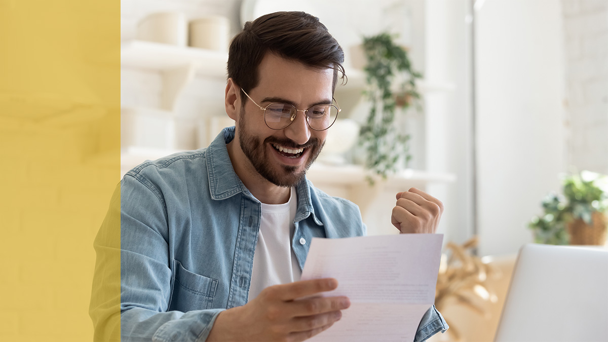 Person excited and holding a paper